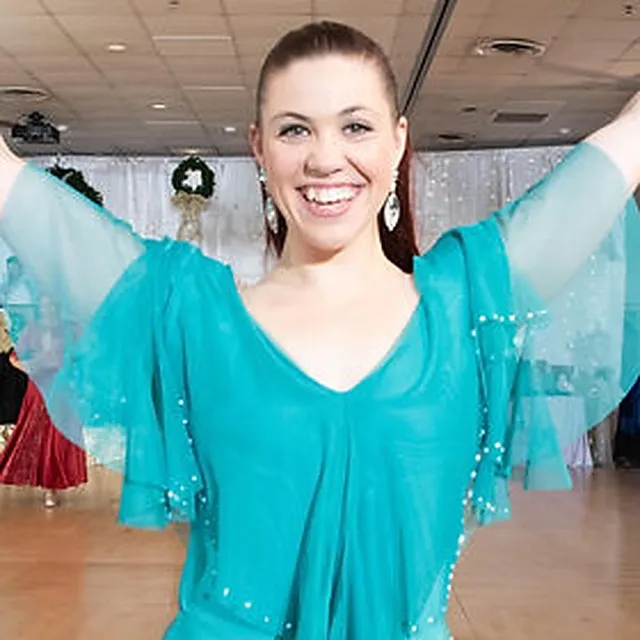 Rachel Miller, wedding-dance teacher and choreographer, smiling on a ballroom floor